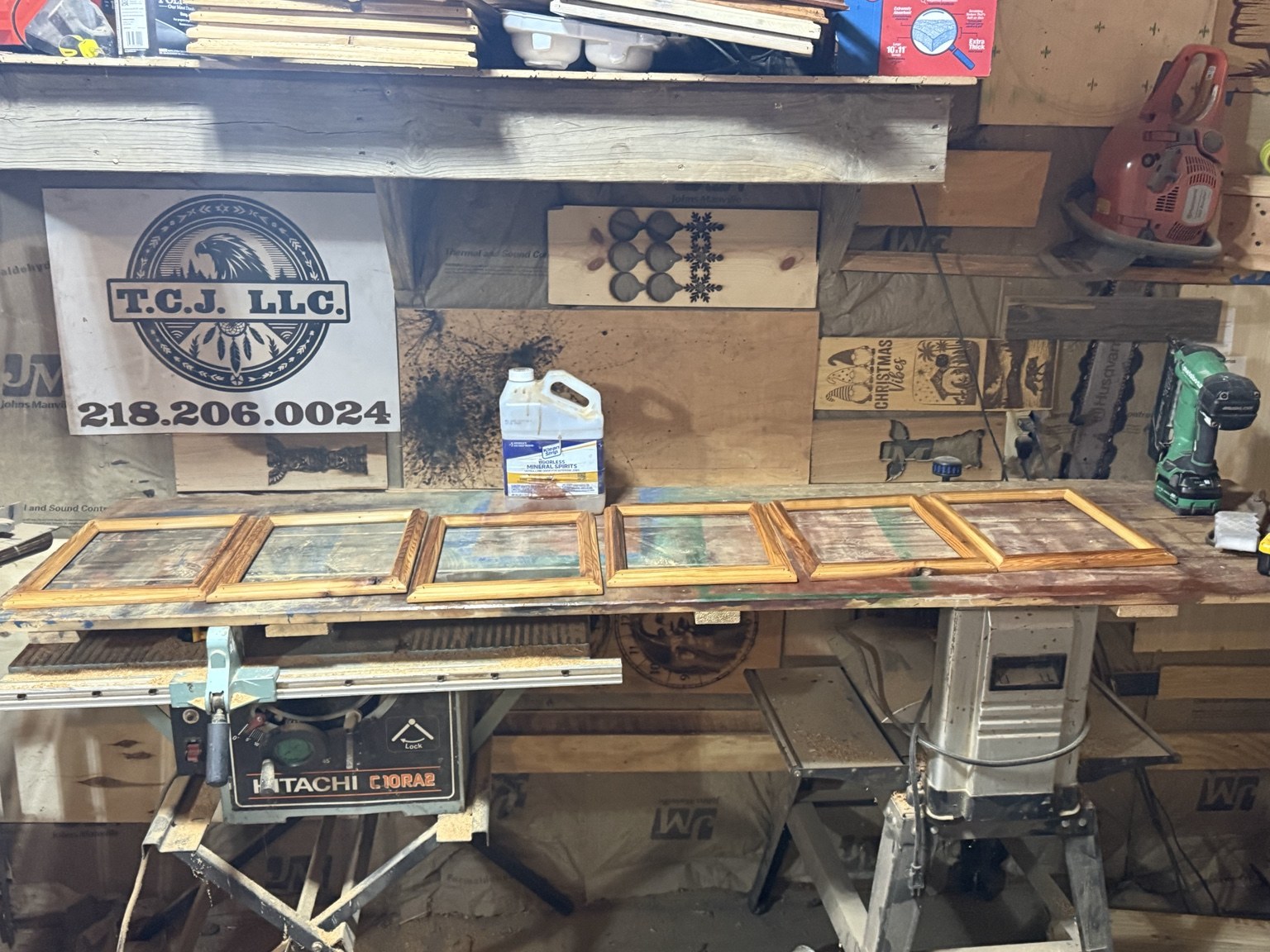 Handmade wooden frames with different finishes in Tim’s workshop