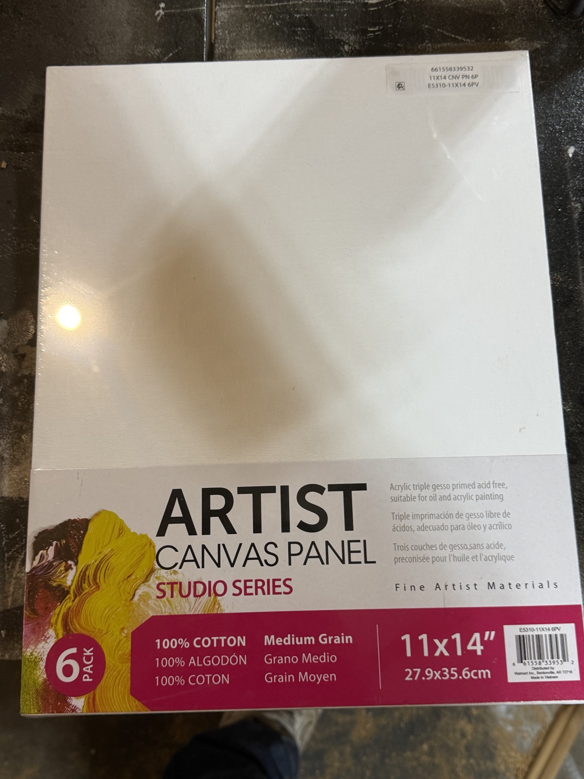 A plain white canvas panel before painting in the TCJ workshop